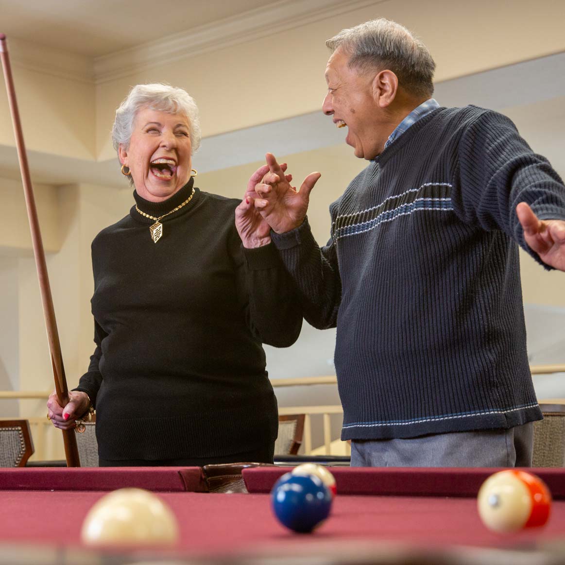 Residents playing billiards at Sterling Heights